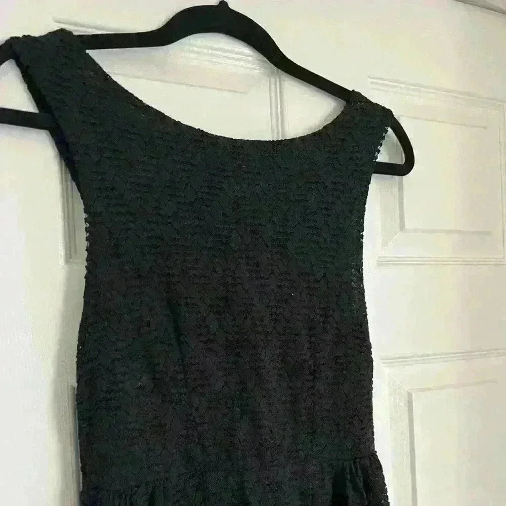Free people black dress with cutout on the side and in the back. Size is XS/S.
